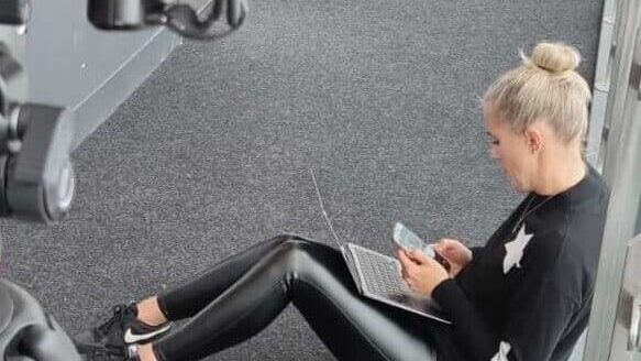 Being multi-skilled in the creative industry means multi-tasking as Lucie is in this image, working on her phone, laptop and in the gym.